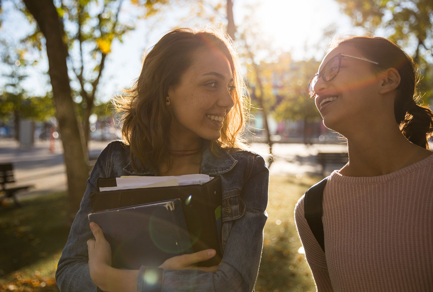 Two People Walking with Books
